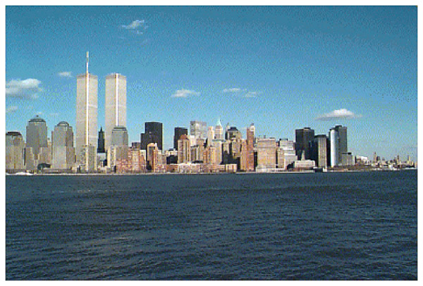 New York City viewed across the river from New Jersey with the World Trade Towers standing tall.