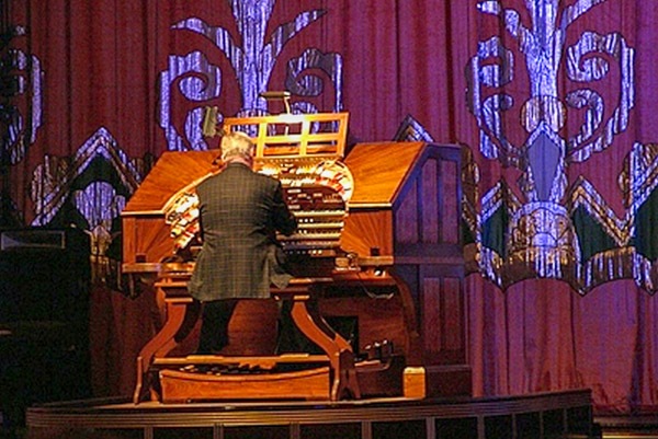 Paramount Theater showing 20,000 Leagues Under the Sea, organ player on platform that riases to stage level