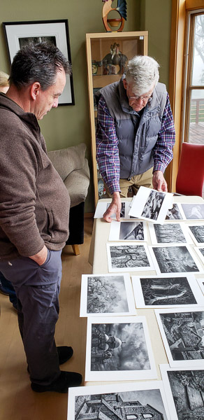 Oliver reviewing students portfolios