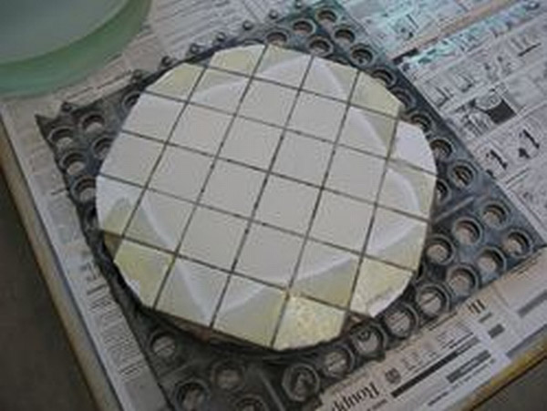 Tile wear is getting out to the edges, but still uneven