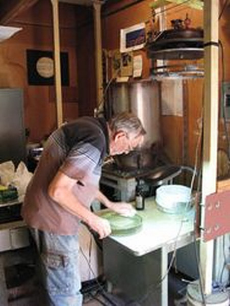 Bob preparing the glass blank surface for coating