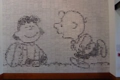 Charles Schultz Museum mosair of cartoon strips forming Charley Brown and Lucy holding the football
