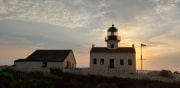 Cabrillo National Monument lite in purple in gold to commorate the passing in the 19th amendment for women's right to vote